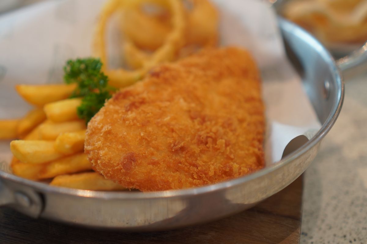 A picture of Breaded fish steak with French fries