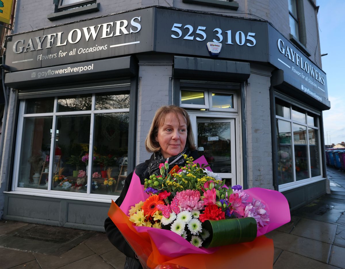 Karen Wood holding a bouquet of flowers