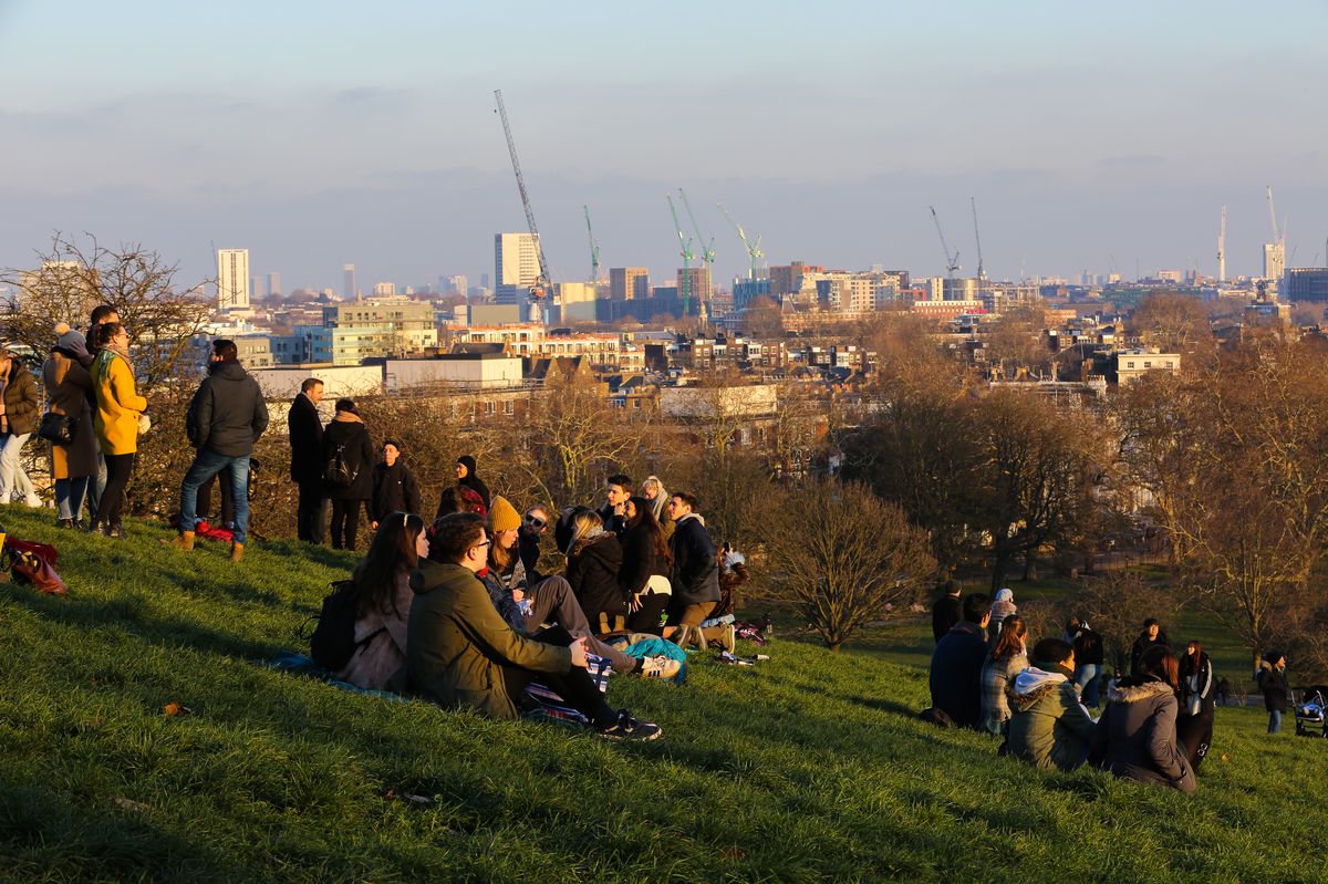 LONDON, UNITED KINGDOM - 2019/01/20: People are seen relaxing at the  Primrose Hill to see the golden winter sunset after a cold and sunny day in the capital. (Photo by Dinendra Haria/SOPA Images/LightRocket via Getty Images)
