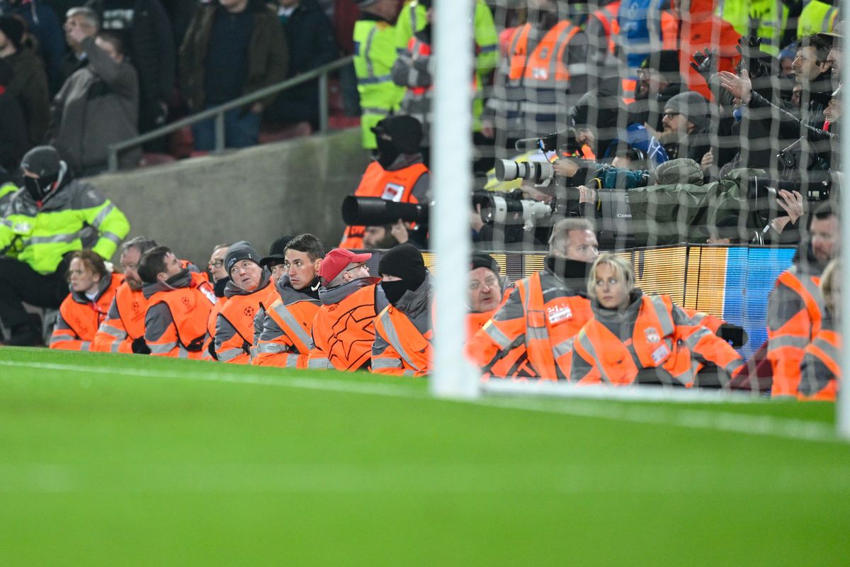 Stewards lie on the sidelines during the UEFA Champions League Round Of Sixteen Leg Two match between Liverpool FC and FC Internazionale at Anfield on March 8, 2022 in Liverpool, United Kingdom