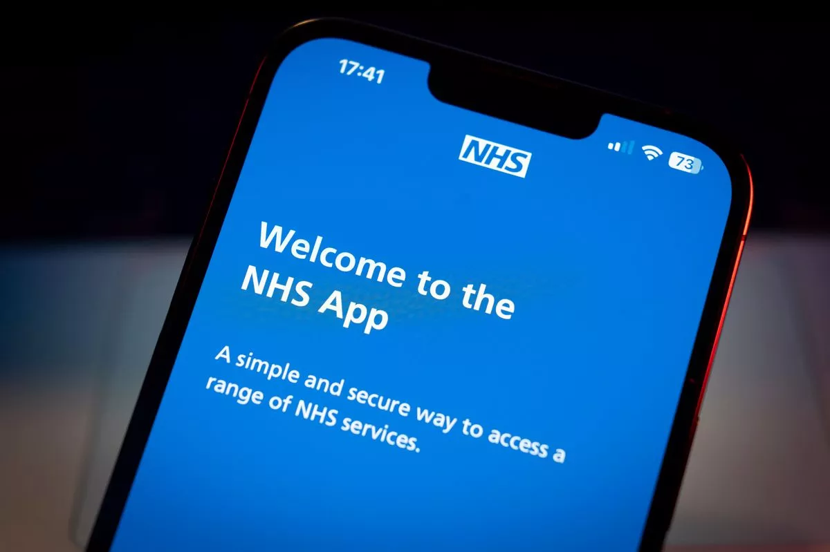 The National Health Service (NHS) application is seen on a mobile device in this photo illustration on 13 July, 2023 in Warsaw, Poland. (Photo by Jaap Arriens/NurPhoto via Getty Images)