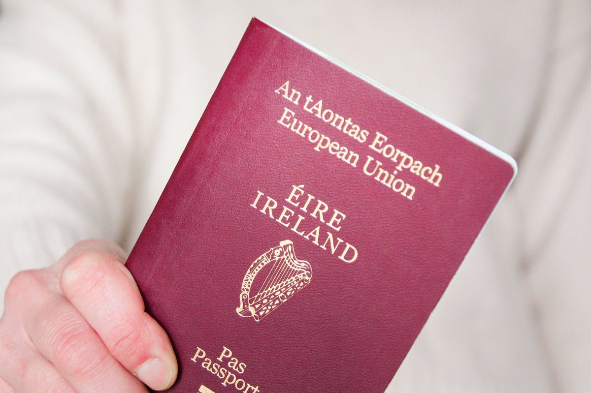 Stock image of Irish passport in someone's hand