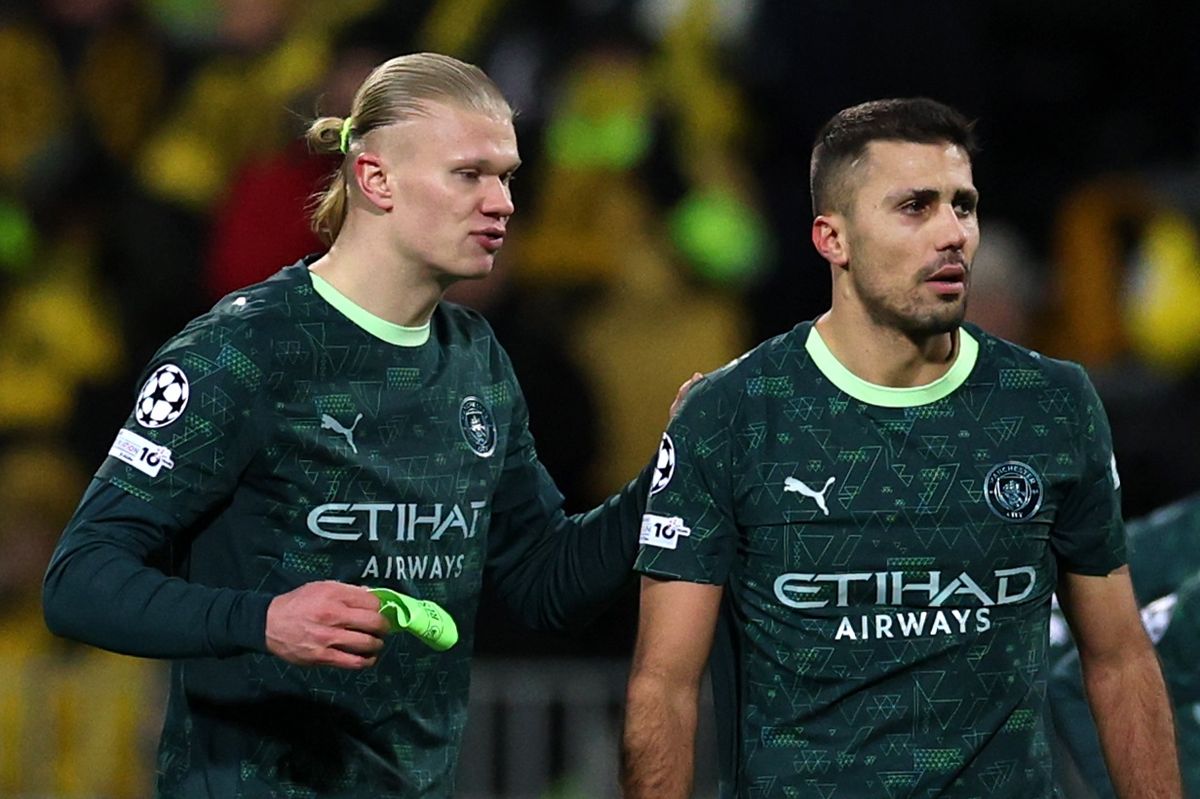 Rodri of Manchester City hands over the captain's armband to teammate Erling Haaland after receiving a red card during the UEFA Champions League 2025/26 League Phase MD7 match between FK Bodo/Glimt and Manchester City 