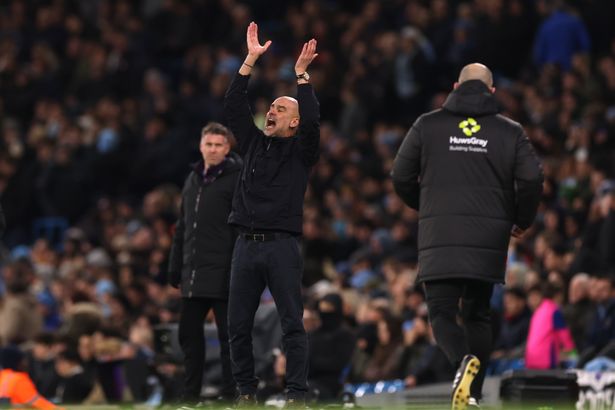 Pep Guardiola rages on the touchline.