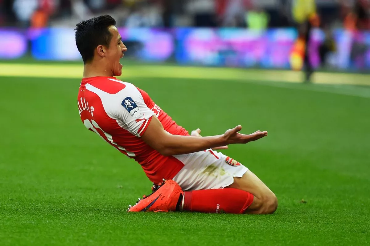 Alexis Sanchez of Arsenal celebrates scoring the the opening goal during the FA Cup Semi Final between Arsenal and Reading at Wembley Stadium on April 18, 2015 in London, England.