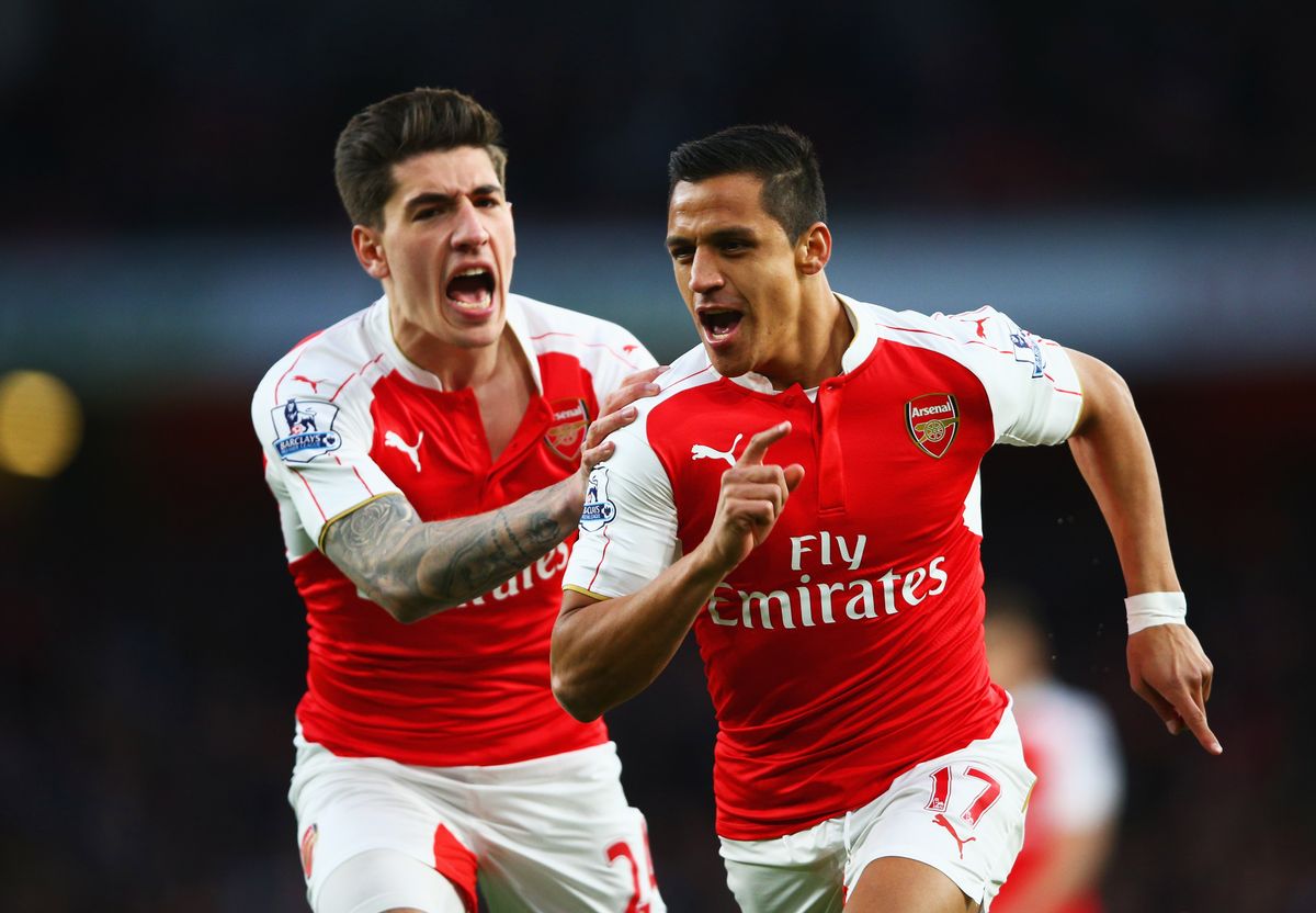 Alexis Sanchez of Arsenal (R) celebrates with Hector Bellerin as he scores their first goal during the Barclays Premier League match between Arsenal and West Bromwich Albion at the Emirates Stadium on April 21, 2016 in London, England. 