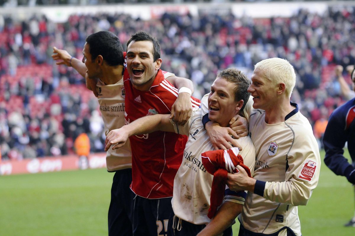 Barnsley's Brian Howard (C-R) celebrates with team mates Martin Devaney (C-L), Anderson De Silva (L) and Bobby Hassell (R) over Liverpool during FA cup match at Anfield, in Liverpool, on February 16, 2008.