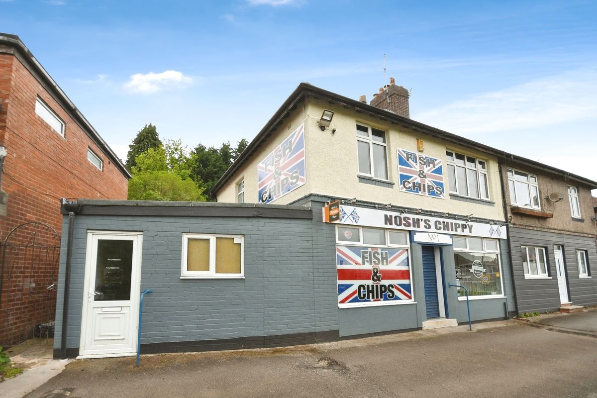 Picture of the house from the front showing the chip shop