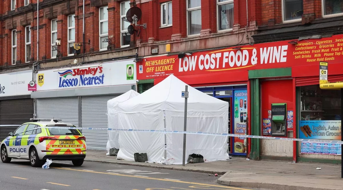 Police at the scene at Low Cost Food and Wine on Stanley Road in Bootle