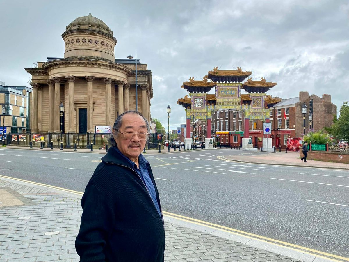 Peter Foo outside the famous arches at Liverpool Chinatown