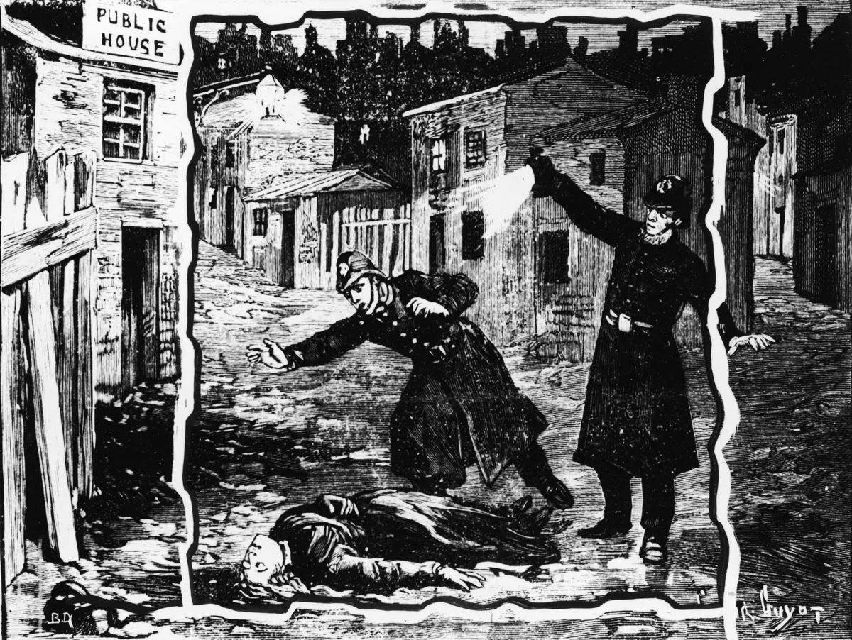 Black and white engraving showing two police officers in long coats, buttoned up the middle. They wear constable's helmets fastened round the chin and a belt with a large buckle. One shines a light while the other reaches out, shocked, as they discover the body of a woman lying in the street. The streets behind them are dark and deserted.