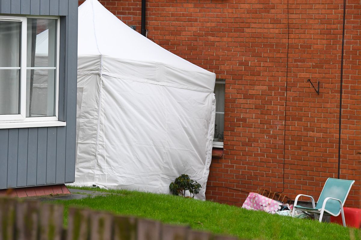 A police forensic tent at the back of Gerards Court.