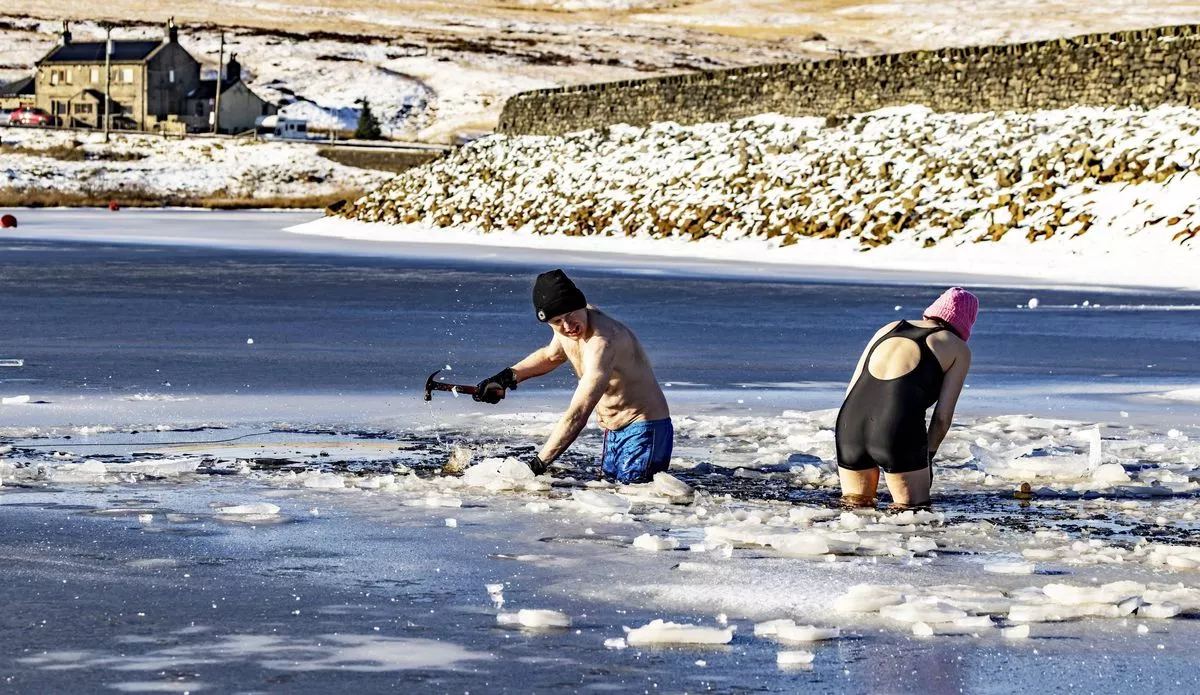 Swimmers take to the frozen water