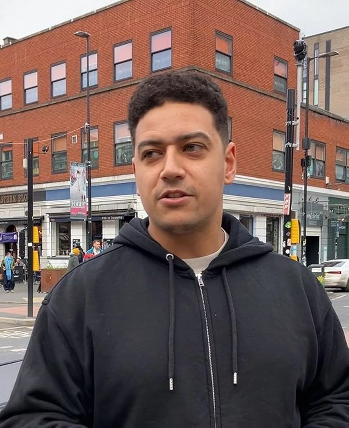 Carpenter interviewed about new years resolutions on a Manchester street