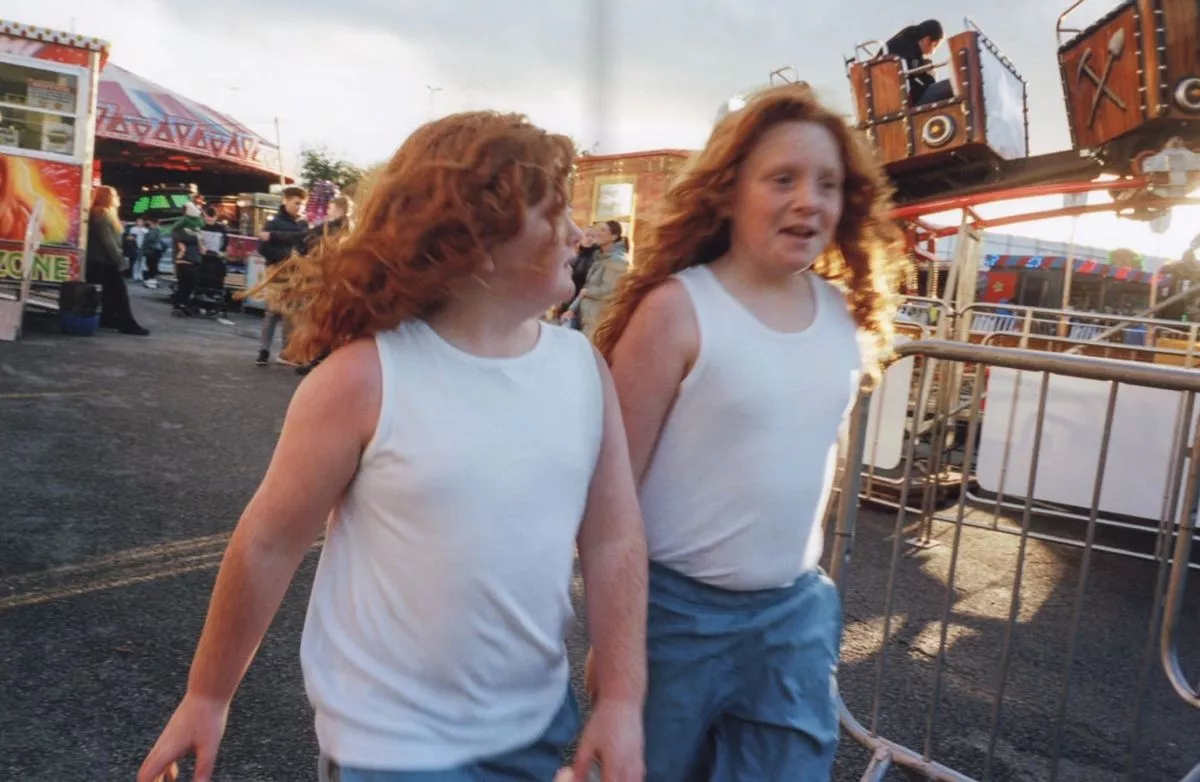 Two young travellers enjoying the fair.