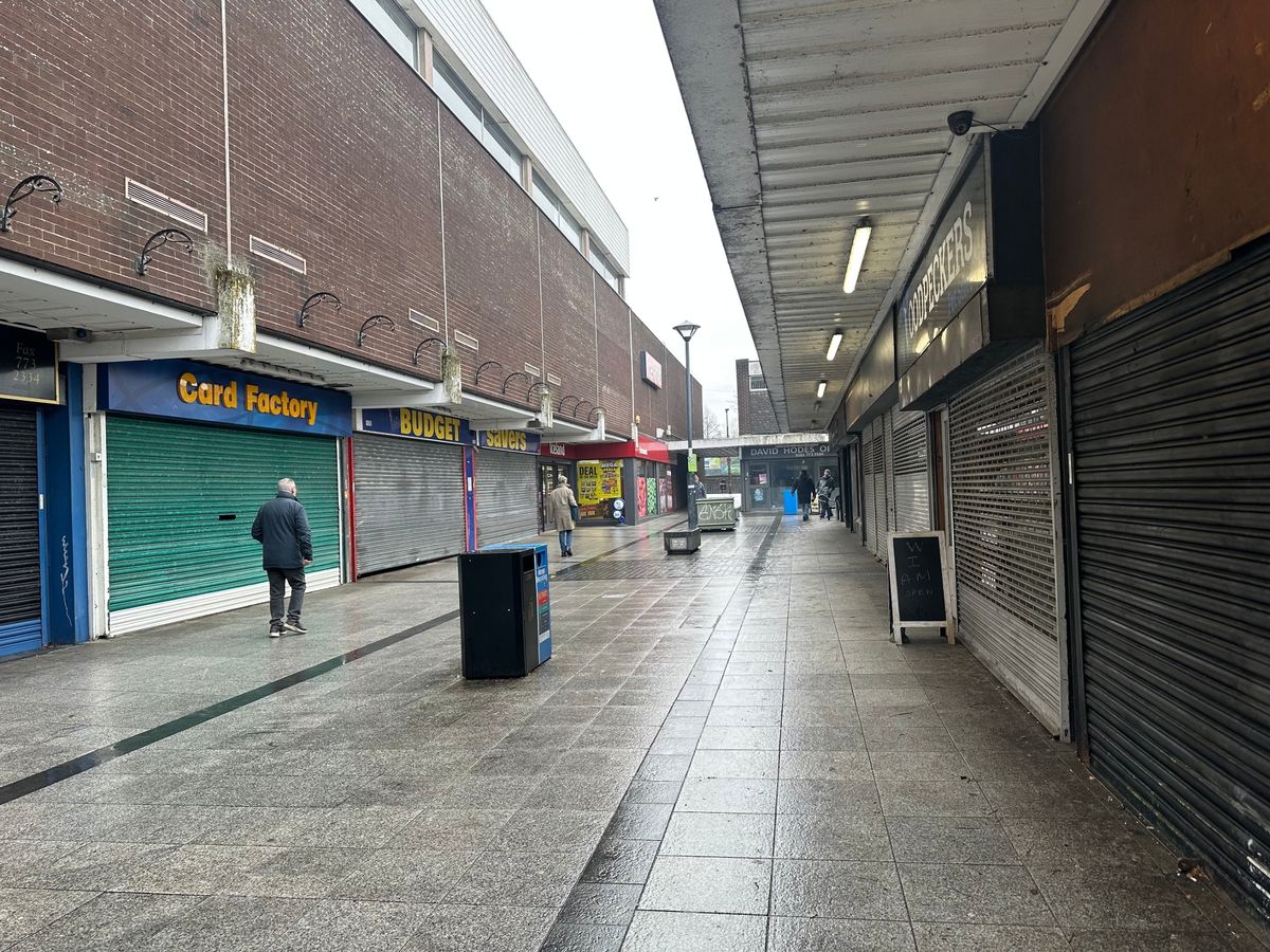 Shuttered shops in Prestwich precinct.