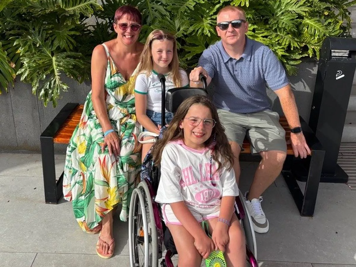 Sophie Gould with her mum Pearl, dad Mark and sister Amelia
