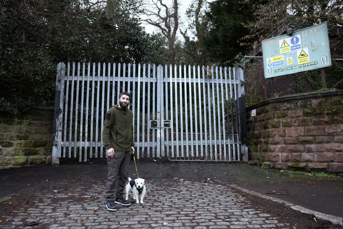 Tom Wright and his dog outside Woolton Hall on Speke Road