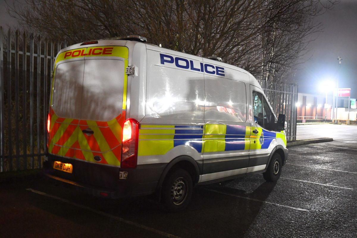 Police in the Home Bargains car park near Breck Road