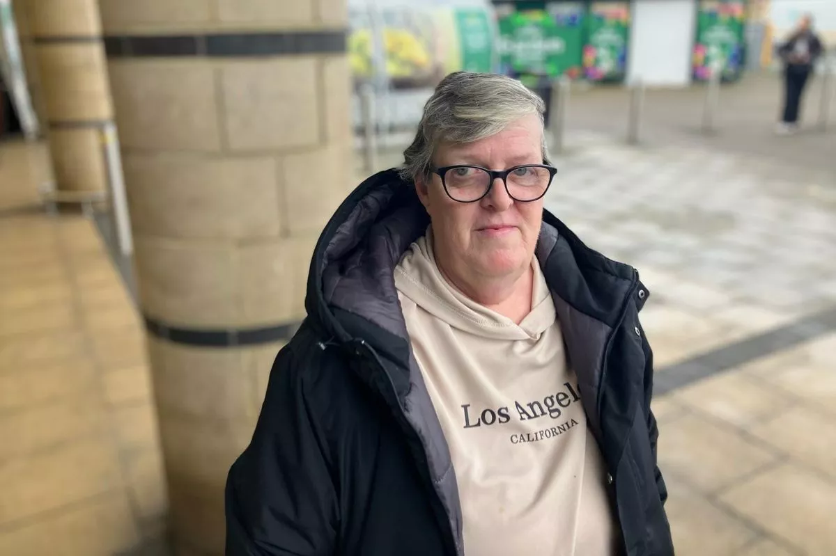 Gillian Mather by the bus stops at Morrisons in Speke, Liverpool