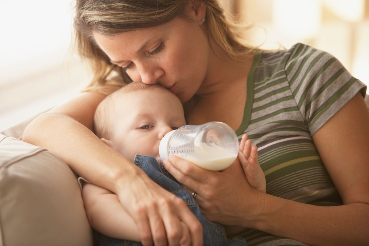 Mother feeding baby a bottle