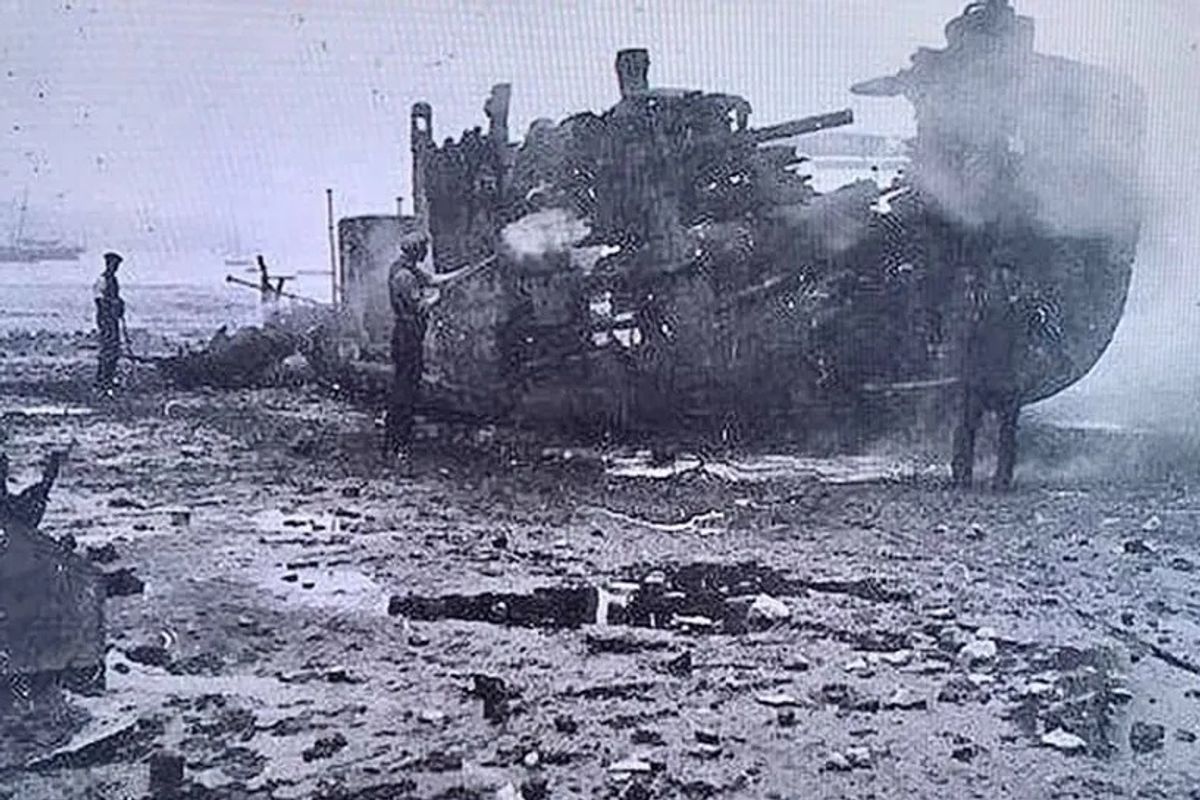 The battered remains of the ship after it crashed into New Ferry pier
