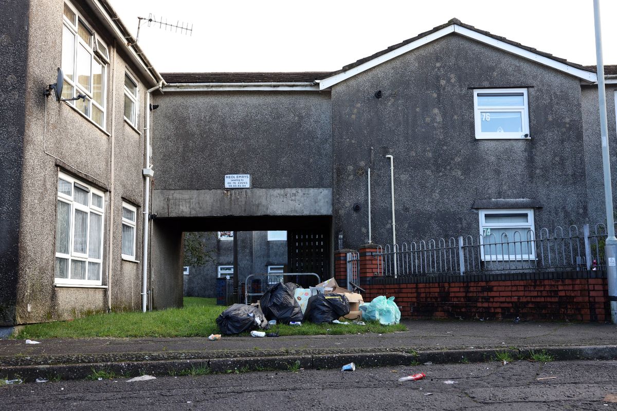 Bins outside a two storey block of flats