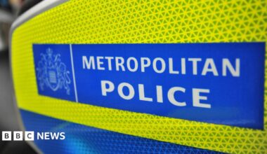 The Metropolitan Police sign on the side of a police motorcycle