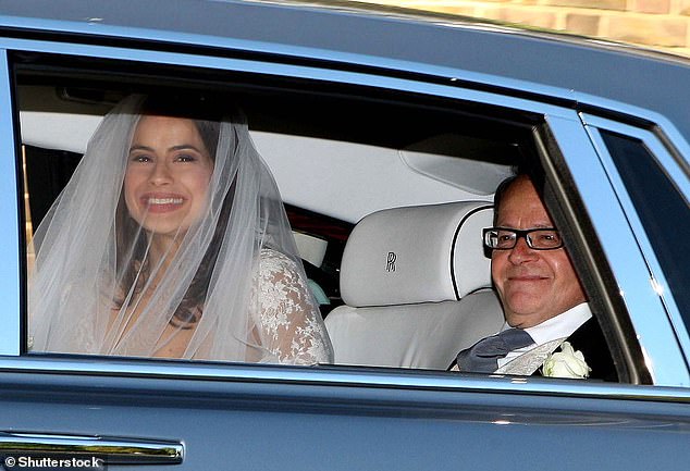 Claudia and Sophie's father is publisher Barry Winkleman and the girls grew up apart (Sophie and Barry pictured on her wedding day in 2009)