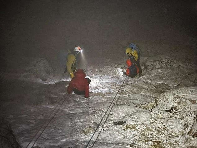 Two hikers were rescued off Britain's second highest mountain in minus 15C temperatures wearing just jogging bottoms and trainers