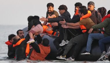 Migrants in France clambering into a small boat bound for Britain in July last year