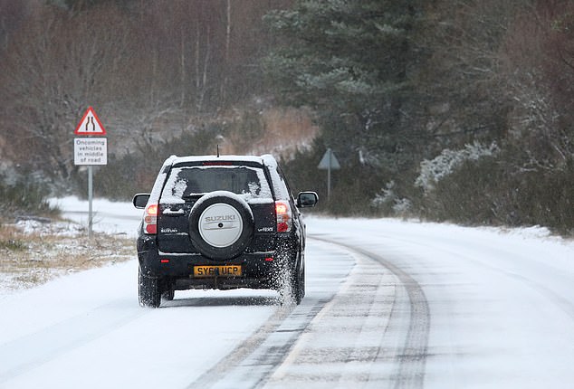 A car drives through snow at Moy near Inverness on New Years Day (1st Jan 2026) as parts of the North of Scotland woke up to a dusting of snow with more forecasted