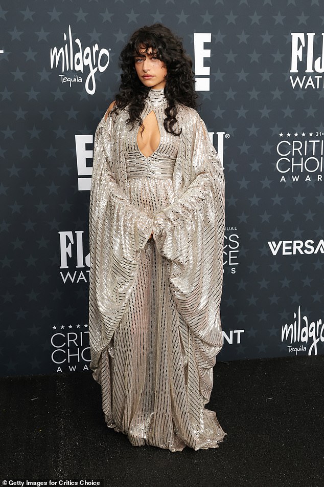 Odessa A'zion, 25, wore a sparkling statement silver gown with dramatic billowing sleeves