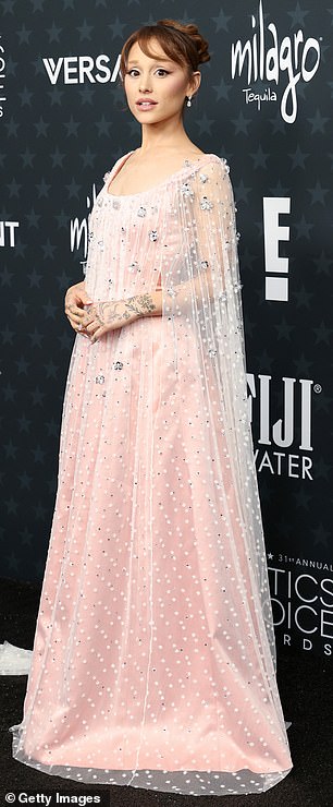 Grande cut an ethereal figure in a delicate blush pink Alberta Ferretti gown, teamed with a sheer lace cape