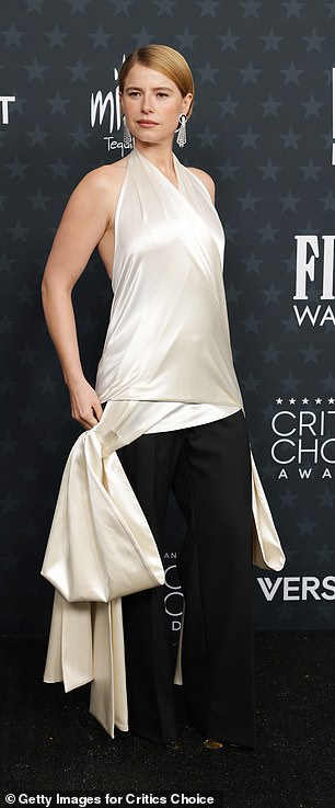 It featured a wrap around white silk top and black pants