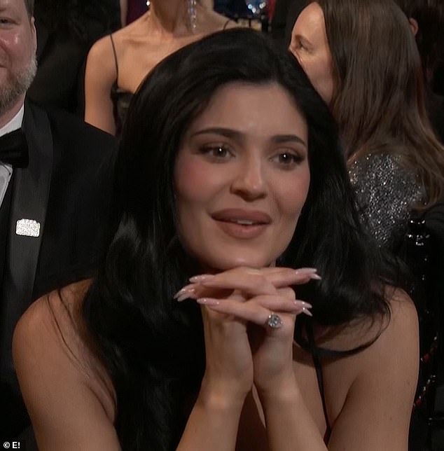 Kylie appeared to have tears in her eyes and she stared adoringly at the actor on stage and said: 'I love you, too.'