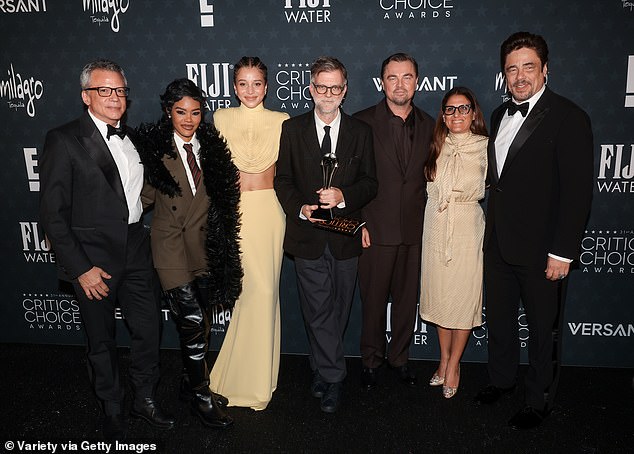 Michael De Luca, Teyana Taylor, Chase Infiniti, Paul Thomas Anderson, Leonardo DiCaprio, Pamela Abdy and Benicio del Toro are pictured left to right in the press room after the big win