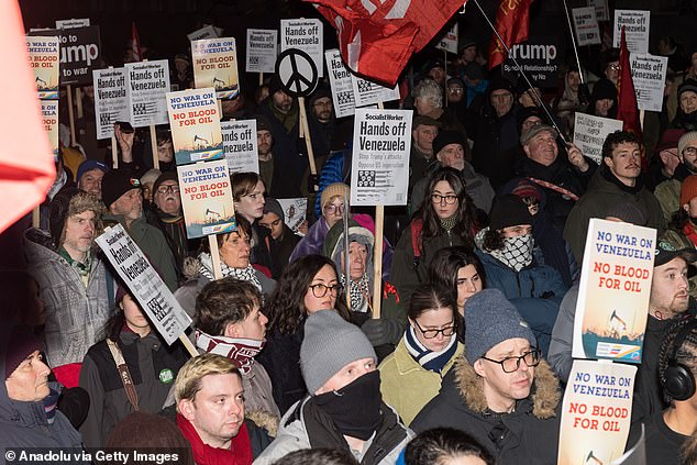 People gather outside Downing Street to protest against the US military attack on Venezuela