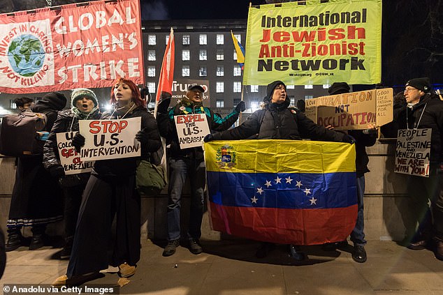 People gather outside Downing Street to protest against the US military attack on Venezuela, calling on the British government to condemn the forced removal of Maduro