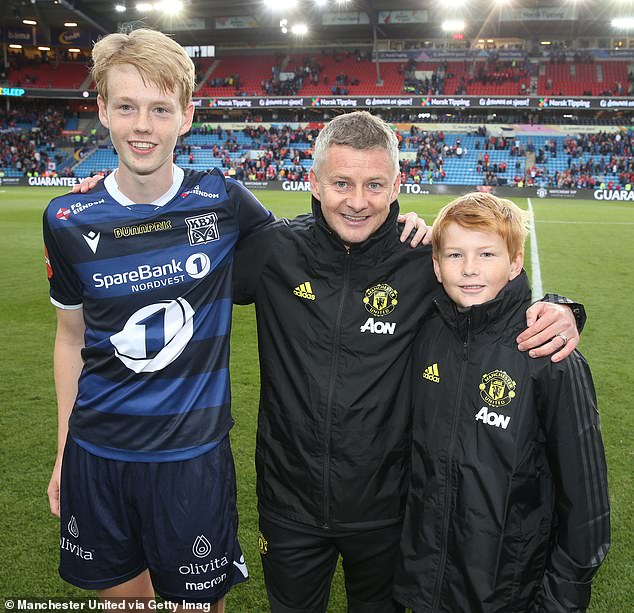After being sacked by United, Solskjaer said he wanted to spend more time with his wife, Silje, and their three children, two of whom he is pictured here with in 2019 while still in charge