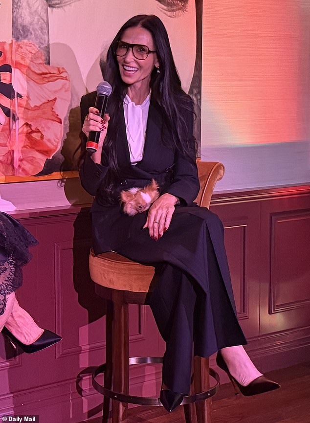 Demi Moore attended a private screening and discussion of Kate Hudson's Neil Diamond movie Song Sung Blue at Soho House in Los Angeles on Wednesday. The star was dressed in a black suit and white shirt with stiletto heels and carrying her petite dog Pilaf