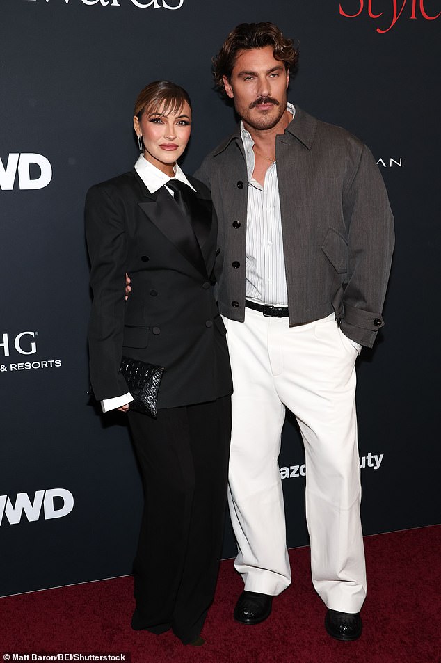 The reality TV fixture, 44, locked arms with Kim Kardashian's hairstylist Chris Appleton on the red carpet