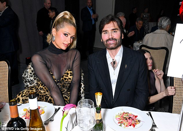Paris Hilton was seated next to WWD editor-in-chief Michael Atmore