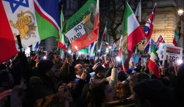 People take part in a rally in solidarity with protesters in Iran today outside Downing Street