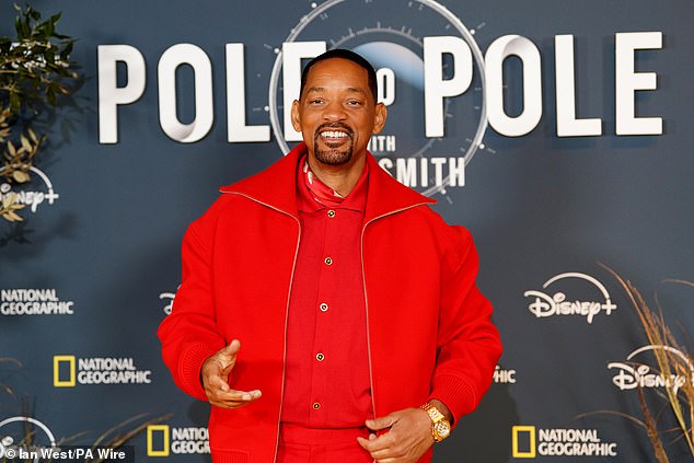 Dressed in a striking red co-ord, Smith appeared carefree as he posed up a storm on the evening's yellow carpet