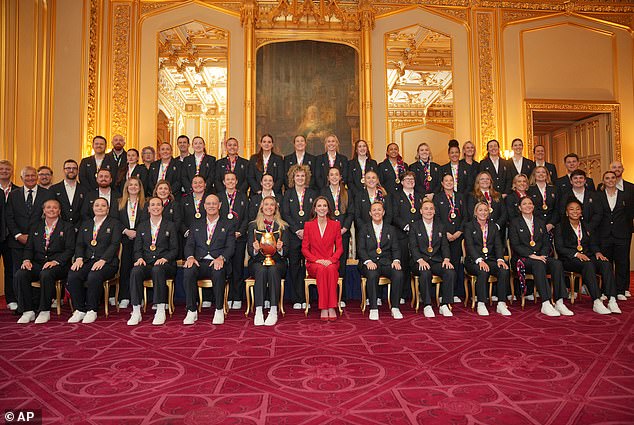 Kate poses with members of the England Women's rugby team at Windsor Castle today