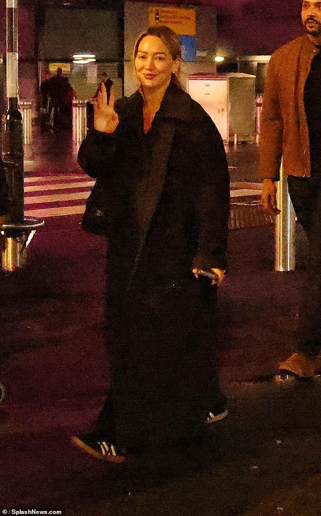 Hilary Duff officially touched down in London on Friday ahead of her nostalgic concert amid Ashley Tisdale's 'toxic mom group' drama