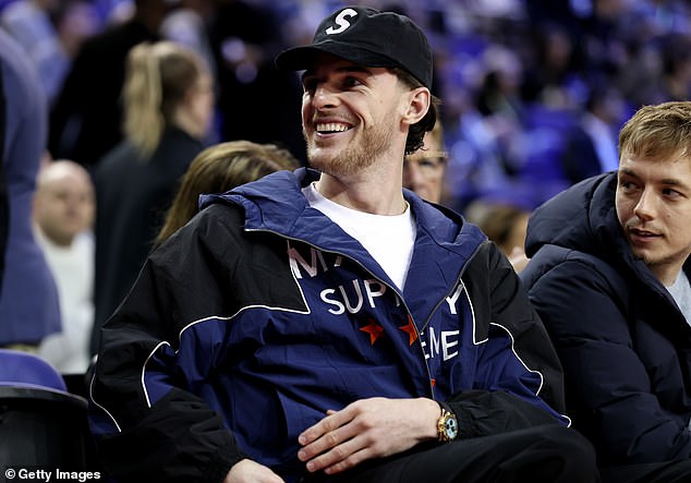 Arsenal midfielder Declan Rice was seen wearing a huge smile as he sat courtside on Sunday