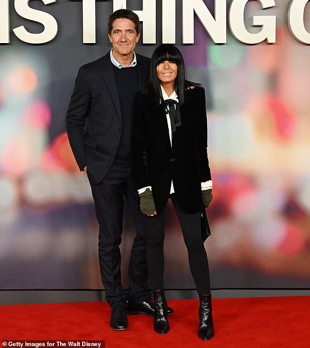 Co-producer Kris Thykier (pictured with wife Claudia Winkleman) stepped out in a navy two-piece suit, a matching jumper and a crisp light blue shirt