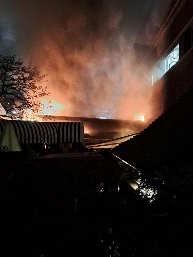 The sky was lit up bright orange as the flames raged in the rooftop garden bar at the top of the nine storey office block in High Street Kensington